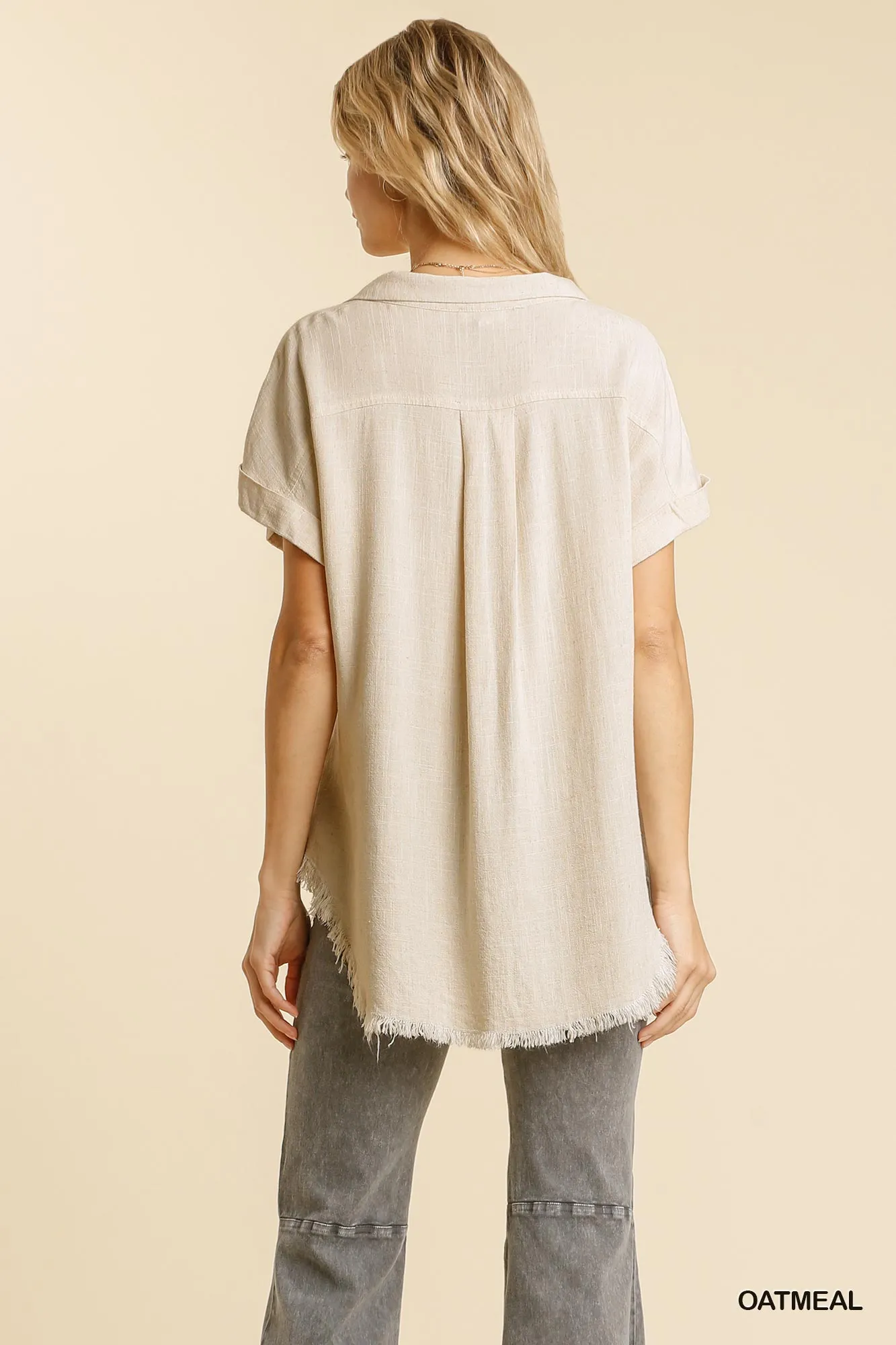 Linen blend button down collar folded sleeve top with chest pocket and frayed edged hi-low hem