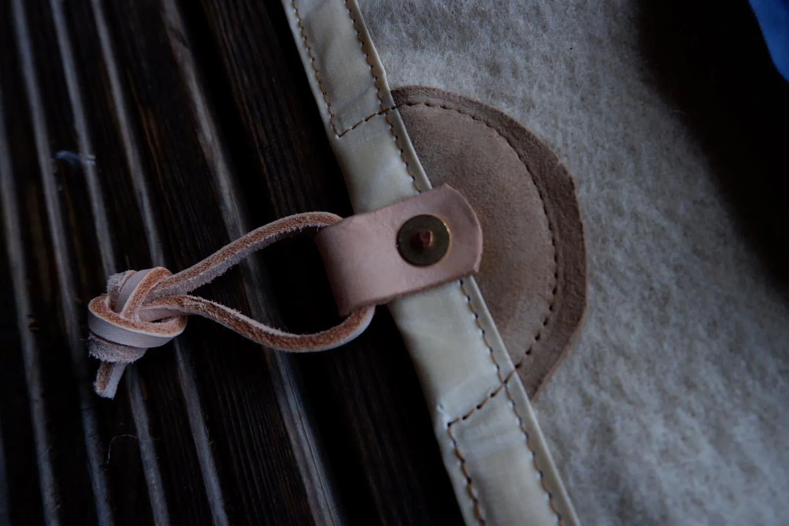 Sleeping mat cover, waxed-canvas-backed wool with leather tie-outs